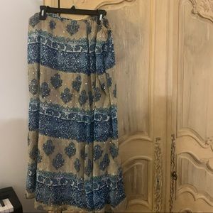 Sparkly large blue floral skirt size large. Very flattering over the knee skirt.